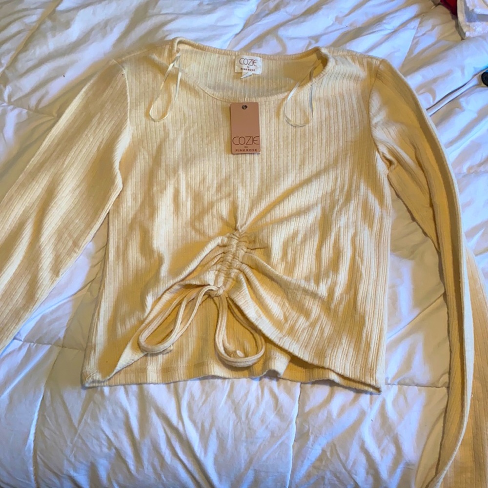 cream colored cinched long sleeve
